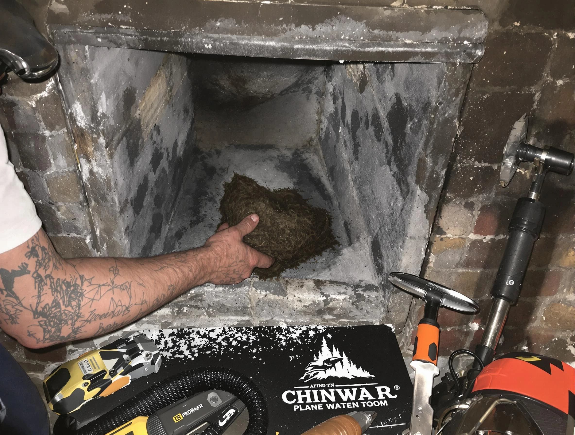 Centerville Chimney Sweep safely removing debris and screening chimney in Centerville, TN